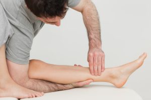serious osteopath massaging