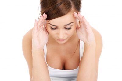a picture of a young woman with headache over white background